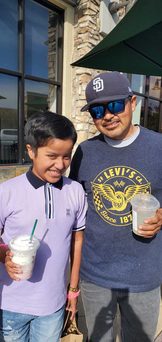 Kid and dad at Starbucks. Sad story. Just Believe Foundation told him to get whatever he would like. Such a cute kid.