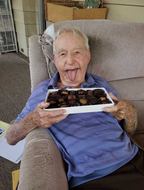 An elderly person enjoying his chocolate