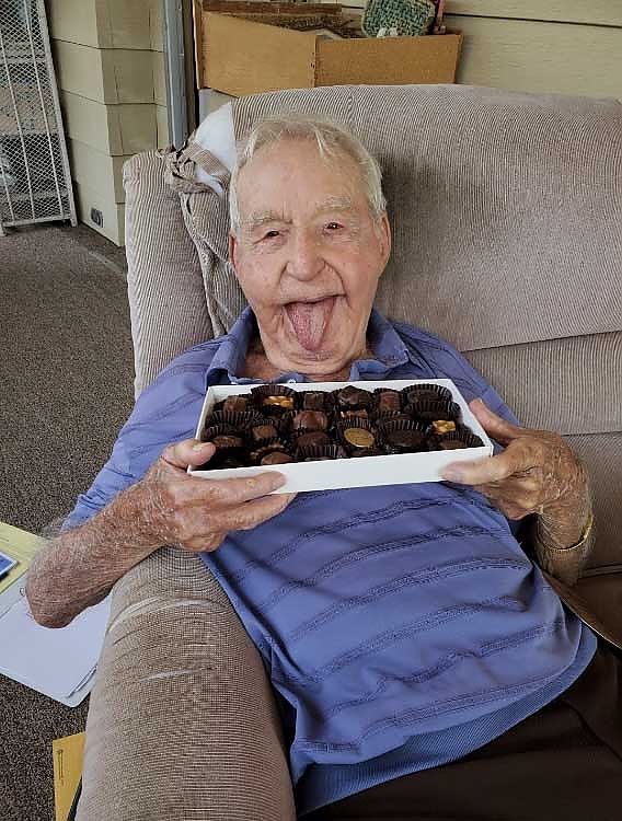 An elderly person enjoying his chocolate